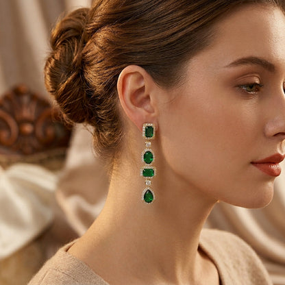 Aretes Colgantes Multiforma de Oro con Esmeralda